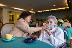 Barbara Marquez, 61, has coffee with her mother, Florence Marquez, 85, Sagebrook Senior Living home in Carmichael, Calif., on Friday, December 16, 2016. (Heidi de Marco/KHN)