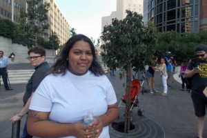 Maria Garcia, 22, said she was able to get a job as a receptionist at a Los Angeles hotel because of the DACA program. The job also came with health insurance, which helped cover physical therapy from a knee injury. She fears getting fired and being unable to pay for her own health insurance and medical care. (Anna Gorman/KHN)