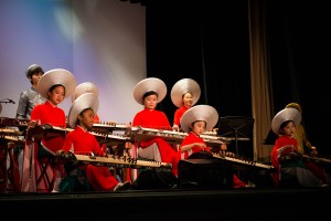 Au Co Vietnamese Cultural Center’s youth ensemble plays traditional music on the Đàn Tranh, or Vietnamese zither. Photo courtesy of Au Co