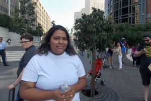 Maria Garcia, 22, said she was able to get a job as a receptionist at a Los Angeles hotel because of the DACA program. The job also came with health insurance, which helped cover physical therapy from a knee injury. She fears getting fired and being unable to pay for her own health insurance and medical care. (Anna Gorman/California Healthline)