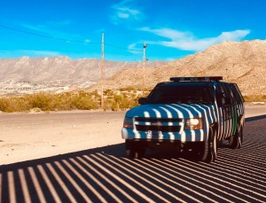 A Border Patrol truck in the shadow of the border wall in Sunland Park, NM, near where the UCP had its camp.