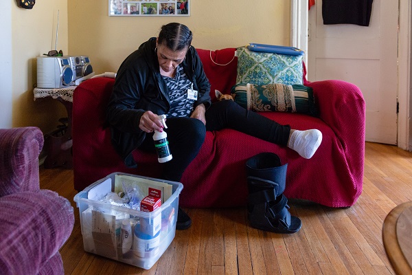 Patricia Zamora gets ready to clean the wound on her foot on Nov. 1, 2018. Zamora was first diagnosed with gestational diabetes and eventually with conventional Type 2. (Heidi de Marco/Kaiser Health News)