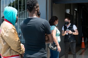 Migrants and a few Tijuana locals wait to be seen at the Resistencia en Salud clinic. (Heidi de Marco/KHN)